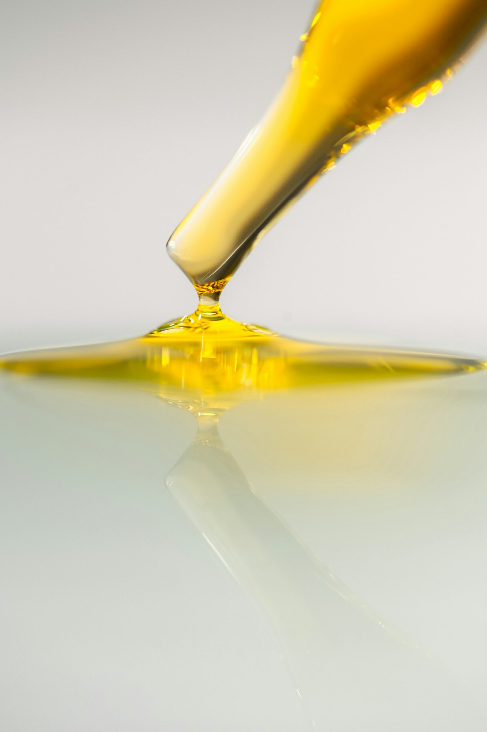 Golden oil being poured