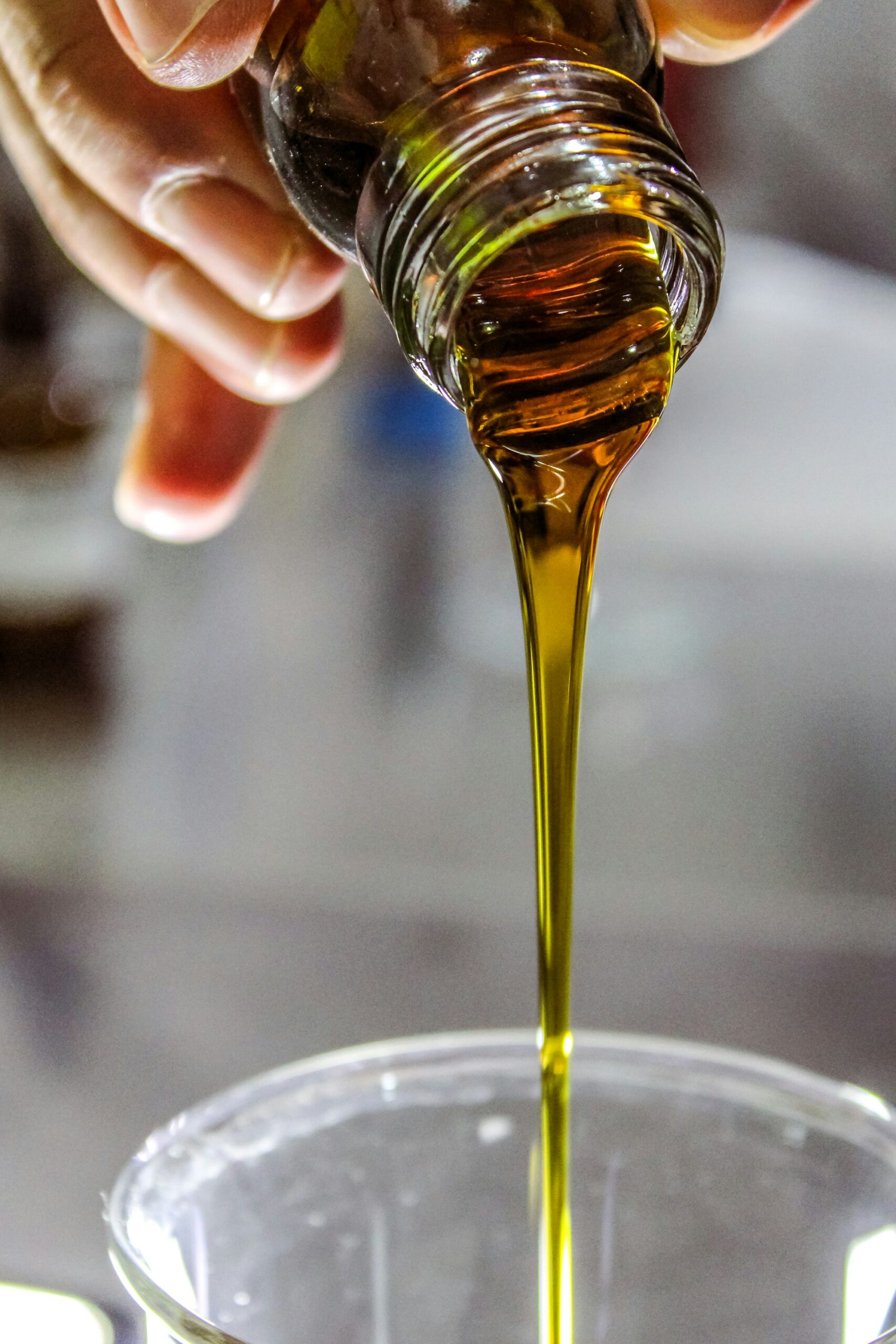 Bottle of olive oil with olives